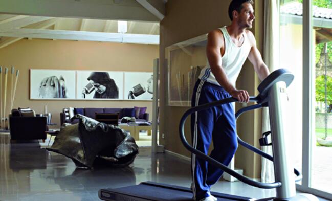 Workout on treadmill by carrying some weights